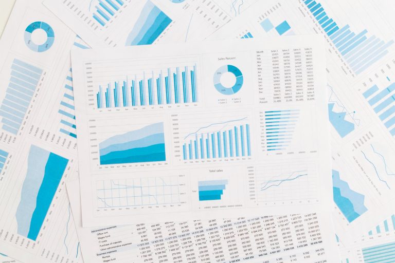Sales reports and charts on spreadsheet for marketing KPI framework tracking
